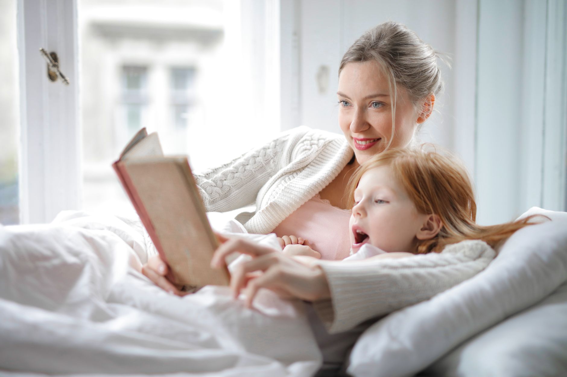 A mother and daughter reading together